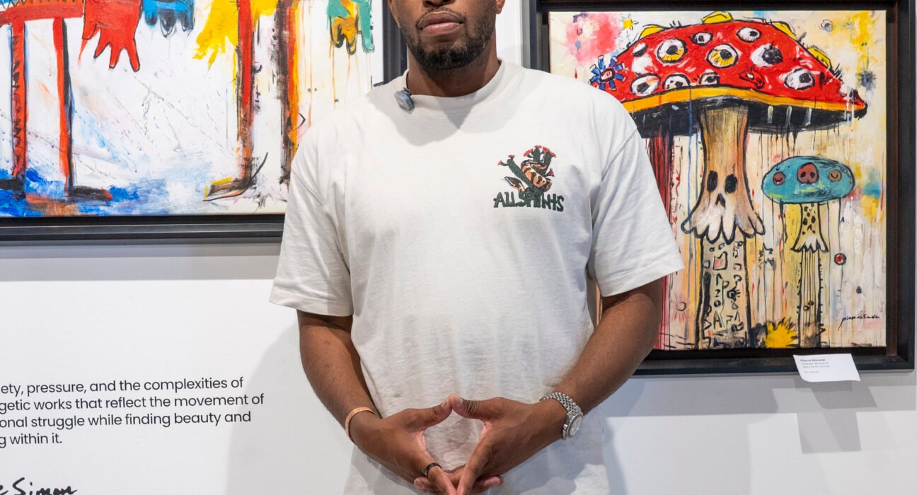 Pierre Simone Haitian contemporary artist with his paintings