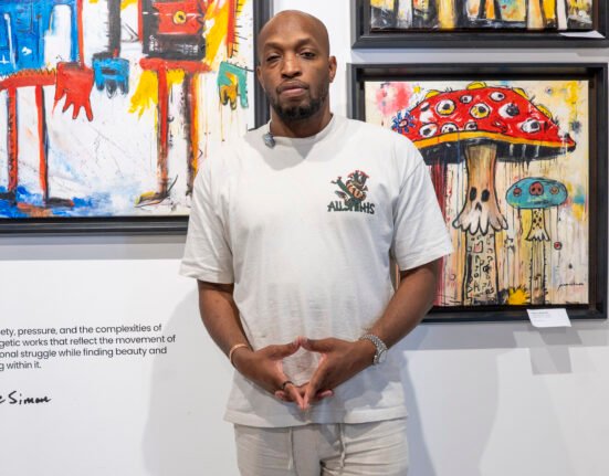 Pierre Simone Haitian contemporary artist with his paintings